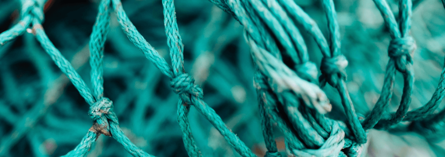 a close-up of a turquoise fishing net