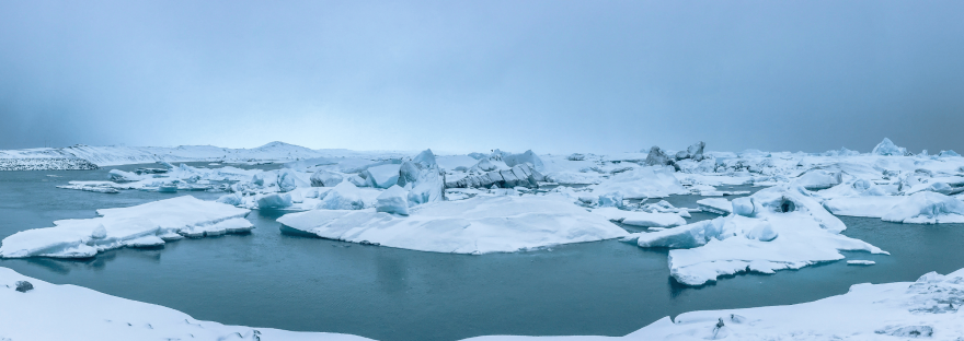 A vast, cold expanse of ice sheets and ocean; photo via Willian Justen de Vasconcellos/Unsplash.